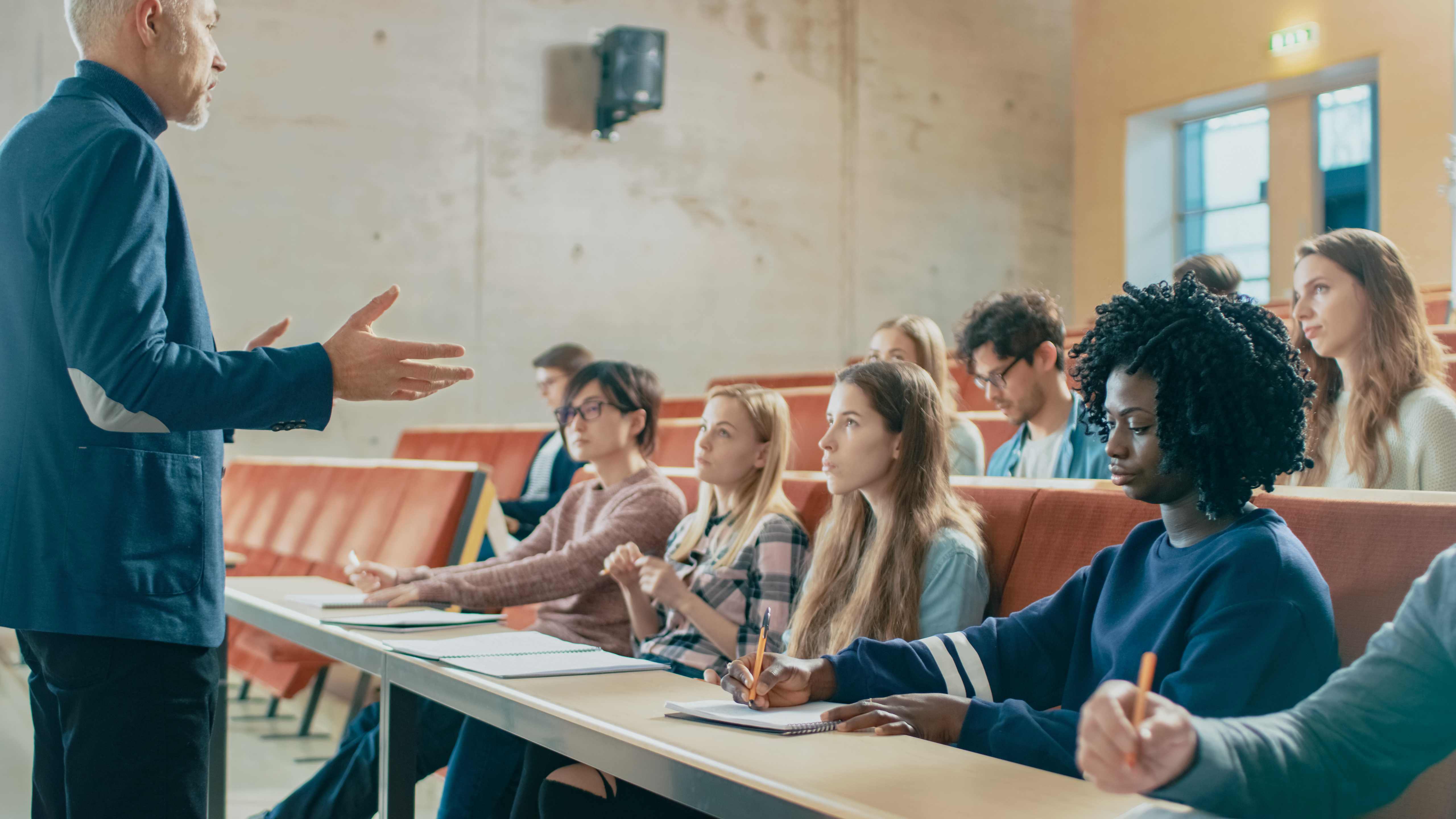 Lecturer helping students understand their subject